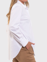 Elegant white Saville Shirt with a crisp collar, oversized fit, and longline design, crafted from a stretchy cotton blend.
