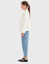 Soundtrack Jacket in white, designed with a classic structure, adjustable sleeves, and a comfortable cotton blend fabric.