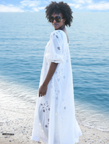 Elegant white Girl Boss Blazer on a hanger, featuring structured shoulders and a sleek silhouette for a polished look.