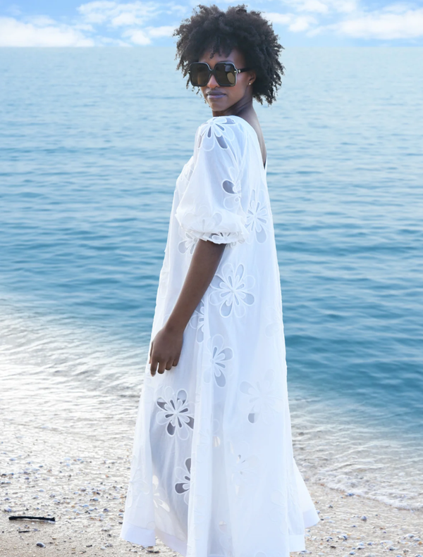 Elegant white Girl Boss Blazer on a hanger, featuring structured shoulders and a sleek silhouette for a polished look.