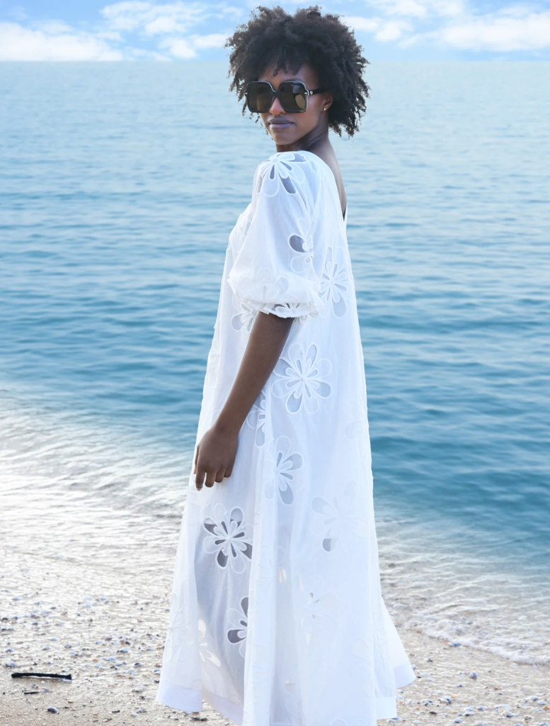 Elegant white Girl Boss Blazer on a hanger, featuring structured shoulders and a sleek silhouette for a polished look.