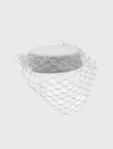 Elegant white Zahra Pillbox Hat with structured base and chic veiling, perfect for race day or formal events.