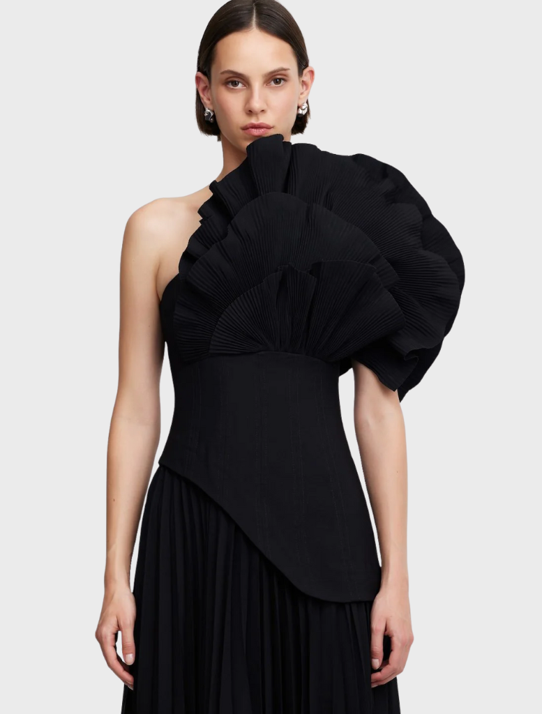 The Whittington gown in black, featuring a refined design with soft draping and a timeless silhouette.