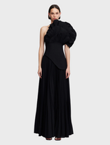 Elegant black Whittington gown displayed on a mannequin, showcasing its flowing fabric and sophisticated design.
