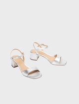 Stylish silver sandal with a wide heel, offering both elegance and support for all-day wear.