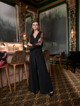 Black wide leg jumpsuit, style number 263723, featuring a relaxed fit and elegant silhouette.