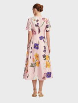 Short Sleeve Midi Dress by Caroline in Wildbloom, adorned with a lively floral print and a chic, flowing design