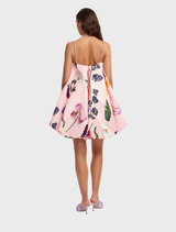 Wildbloom's puff mini dress, embellished and featuring a bright floral pattern, ideal for casual or festive occasions.