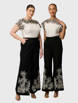 Black Willow Pant in a linen-viscose blend, showcasing a wide-leg design, embroidery detail, and comfortable elasticated waistband.