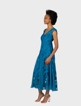 Elegant teal cocktail dress with a V-neck and godet design, perfect for special events and evening wear.
