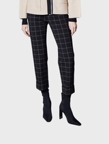 Close-up of a black window pane check design on fabric, emphasizing a refined and traditional aesthetic.