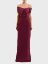 Off-the-shoulder gown in rich wine hue, designed with a flattering silhouette and graceful draping for special events.