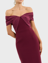 Stunning wine off-the-shoulder gown, featuring a fitted design and elegant drape, ideal for formal gatherings.