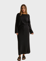 Noir Merino Cotton Skirt from Winter Retreat, designed for warmth and elegance during winter outings.