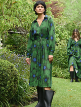Green floral dress with a winter theme, featuring a fitted bodice and flowing skirt, perfect for seasonal occasions.
