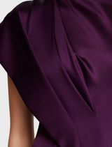 A sophisticated sleeveless silk dress from The Row, emphasizing simplicity and high-quality material.