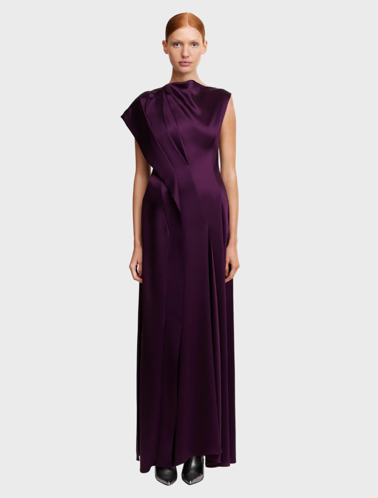  Sleeveless silk dress from The Row, showcasing a sleek design and elegant fabric in a soft, neutral color.