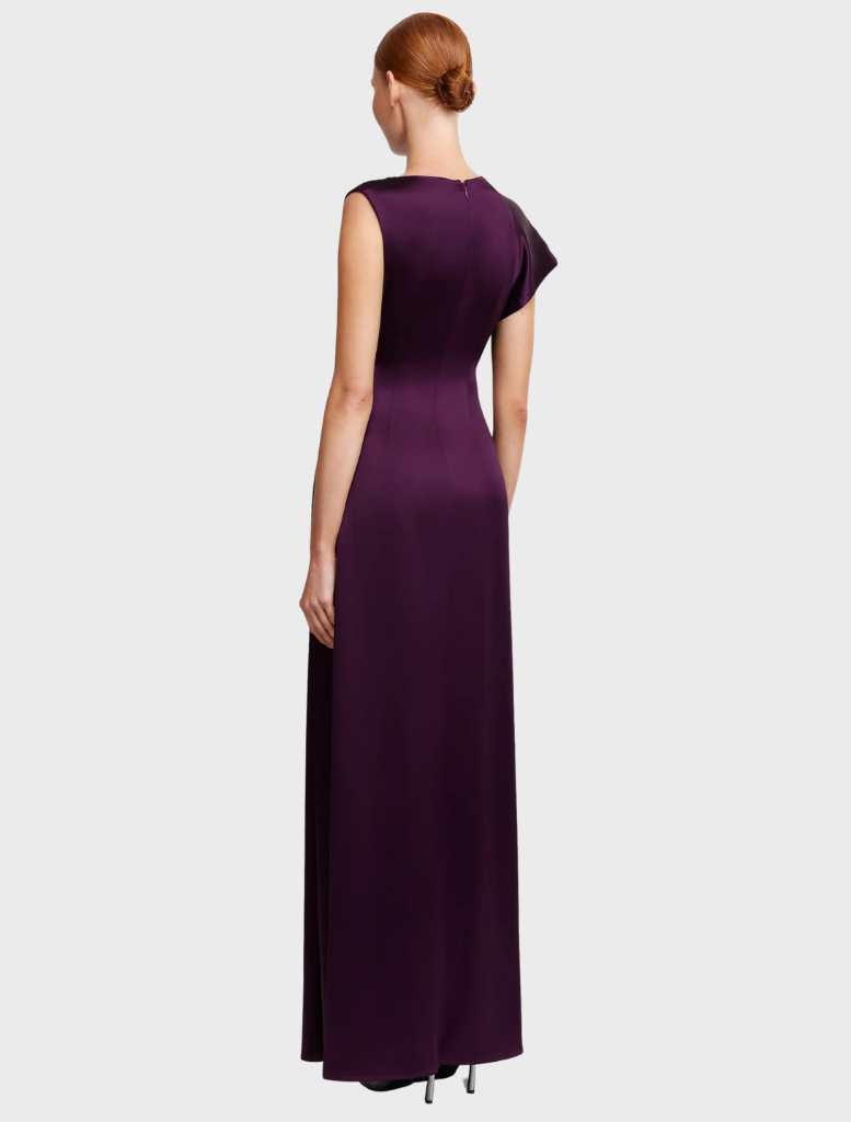 The Row's sleeveless silk dress, highlighting a refined silhouette and smooth fabric in a classic style.