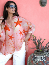 Fashionable pink shell shirt with an eye-catching open back, perfect for adding flair to any outfit.