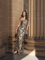 Black and gold Celeste gown with a refined silhouette and exquisite details, perfect for upscale events and celebrations.