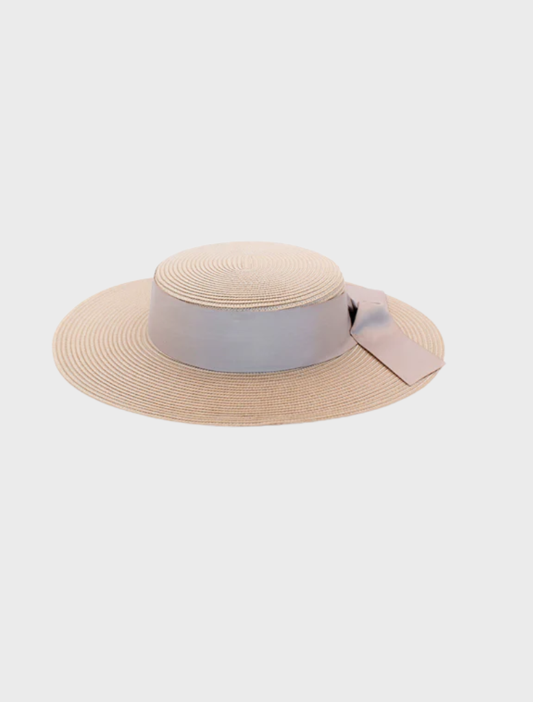 Stylish Clarke Racewear boater in white and nude, designed with a wide brim for sun protection and a fashionable touch.