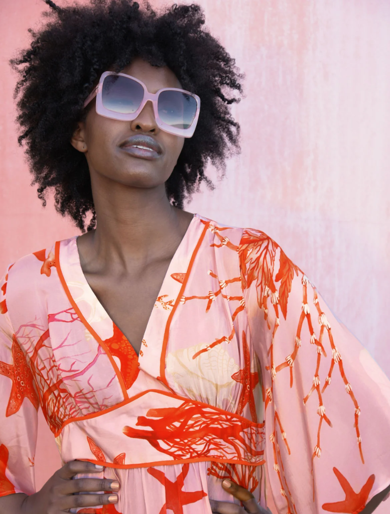 Stylish pink shell dress with a bold fire design, ideal for making a memorable impression at gatherings.