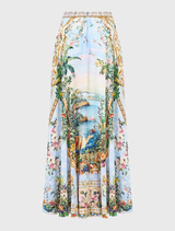 A flowing maxi circle skirt in lilac hues, inspired by Hofburg Palace frescoes, featuring crystal embellishments and side pockets.