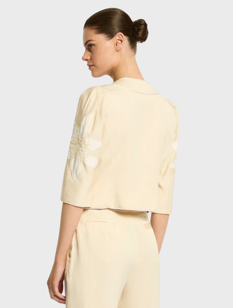 Nikita Jacket in straw color, featuring a stylish design suitable for casual or semi-formal occasions.
