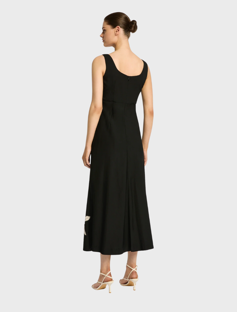 Nikita Midi dress in black, designed with a chic silhouette, perfect for a sophisticated look at any event.