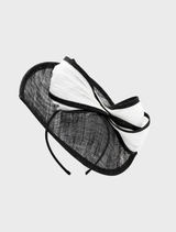 Striking black and white Xanthia fascinator with artistic details, designed to complement elegant ensembles at special events.