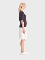 Close-up of a white Acrobat Legion Skirt, emphasizing the fabric and stitching details.
