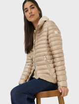 Close-up of a beige Bern quilted jacket, highlighting its soft texture and elegant design details.