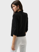 Timeless black blazer showcasing a structured design, notched lapels, and a sleek single-button fastening.