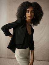 Elegant black tuxedo overpiece, perfect for enhancing formal attire at events.