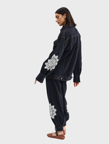 Bowie jacket crafted from indigo denim, adorned with a distinctive lace plaid design for a chic appearance.