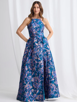 The Clara dress in navy and pink, elegantly draped to showcase its silhouette and design features.