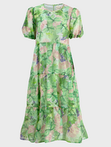 A green dress is a fashionable outfit for a daily basis