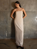 An elegant slip dress with a glittery finish, inspired by the Gatsby era, perfect for formal occasions and evening wear.