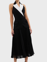 A classic black and white dress highlighted by a white collar.