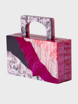 A pink and purple handbag with a chain strap, showcasing the Fleur Acrylic top handle style.