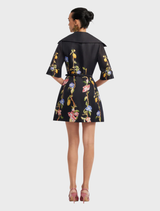 Elegant mini dress in ebony with a vibrant lemon vine print, designed with sleeves for a fashionable and modern style.