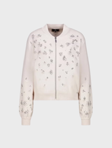 Elegant champagne beige jacket adorned with decorative jewelry accents, perfect for enhancing any outfit.