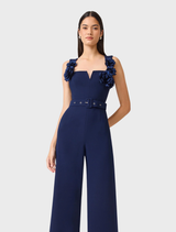 Leonara's deep navy sleeveless jumpsuit showcases a tailored design with a flattering silhouette and wide legs.