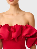 Lucetta's red column gown with off-shoulder neckline, showcasing a sophisticated and modern style.