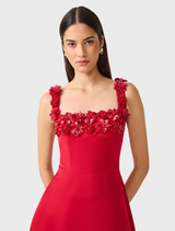 A red midi dress with a square neckline and flared skirt, highlighting the Lucetta brand's stylish design.