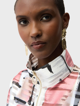 The Organza Abstract Jacket displays a vibrant pink and white print, perfect for a fashionable look.