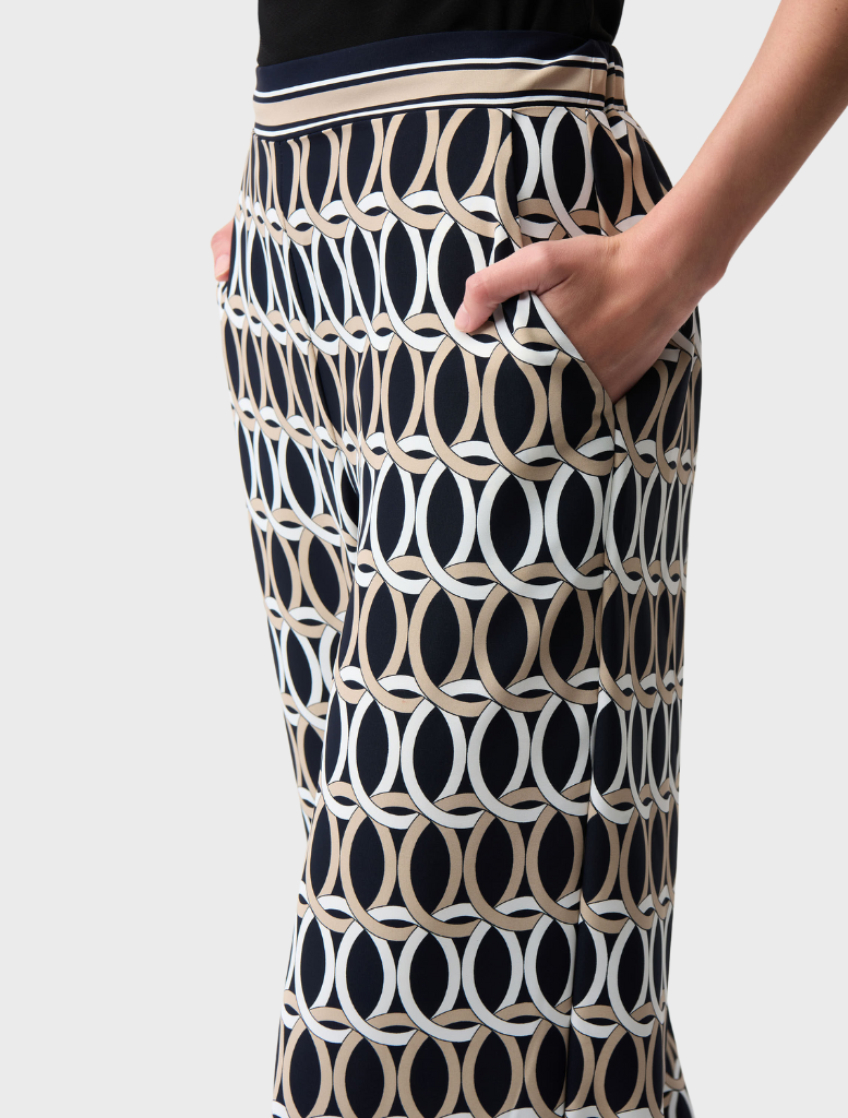 Elegant midnight blue pants adorned with a colorful multi-pattern, ideal for adding flair to any outfit.