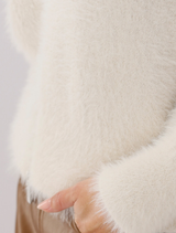 Relaxed-fit plush cardigan jacket in almond hue, showcasing an open front and long sleeves for a stylish layered look.