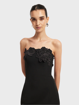 Chic ebony maxi dress featuring a decorative bustier, combining sophistication and comfort.