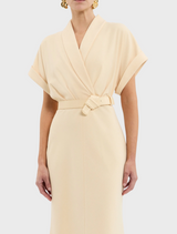 A cheerful yellow dress complete with a belt and collar, embodying a stylish and refined aesthetic.

